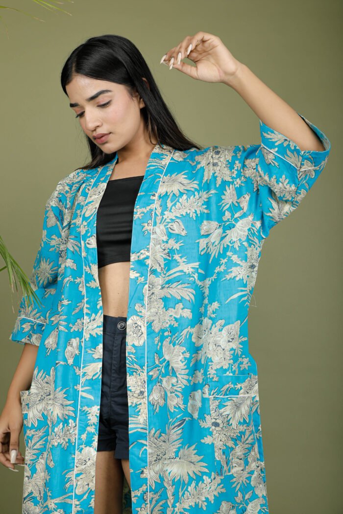 model wearing floral print blue color traditional kimono on olive green background