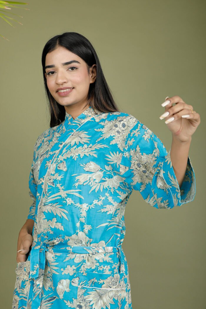 model wearing floral print blue color traditional kimono on olive green background