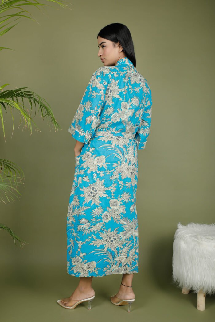 model wearing floral print blue color traditional kimono on olive green background