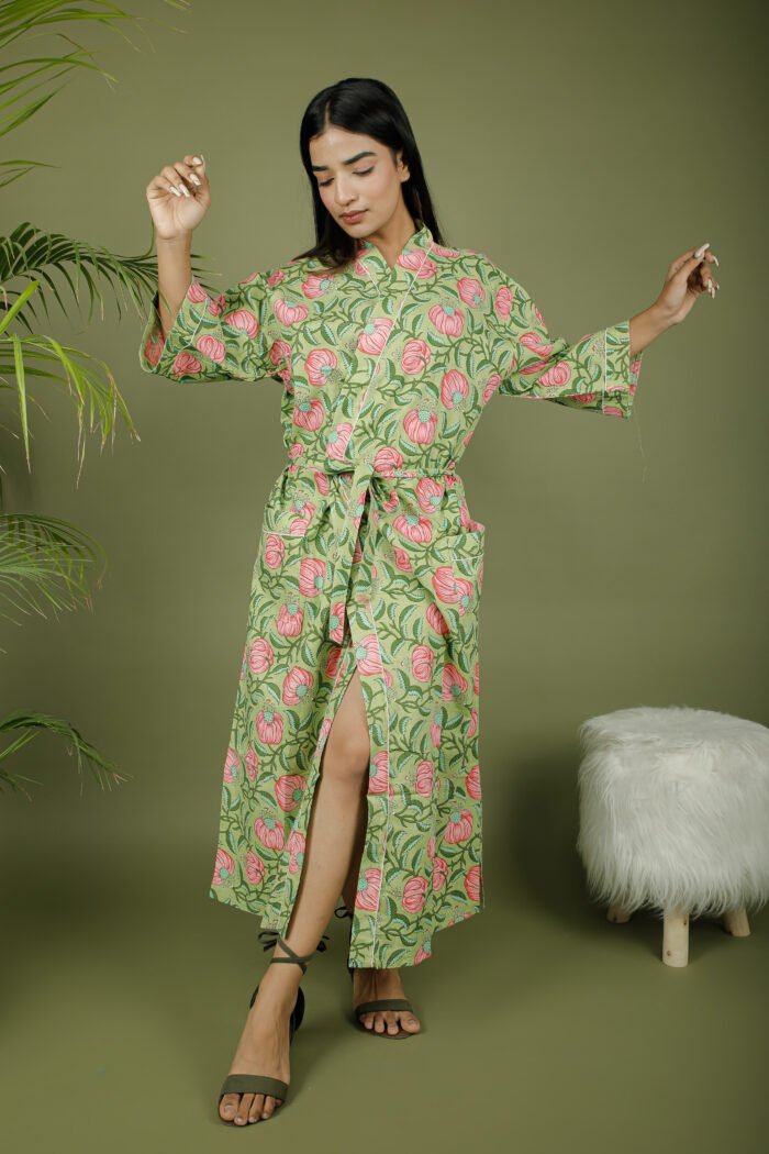 model wearing floral print green color kimono dress on olive green background