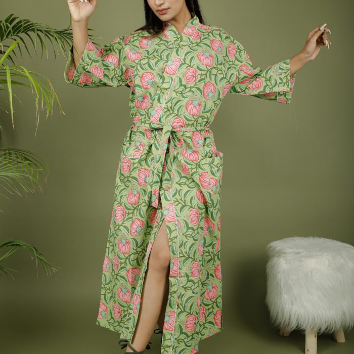 model wearing floral print green color kimono dress on olive green background