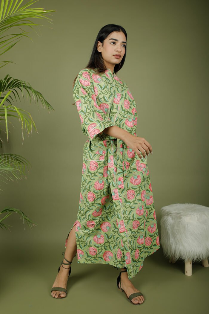 model wearing floral print green color kimono dress on olive green background