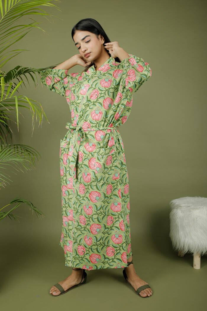 model wearing floral print green color kimono dress on olive green background