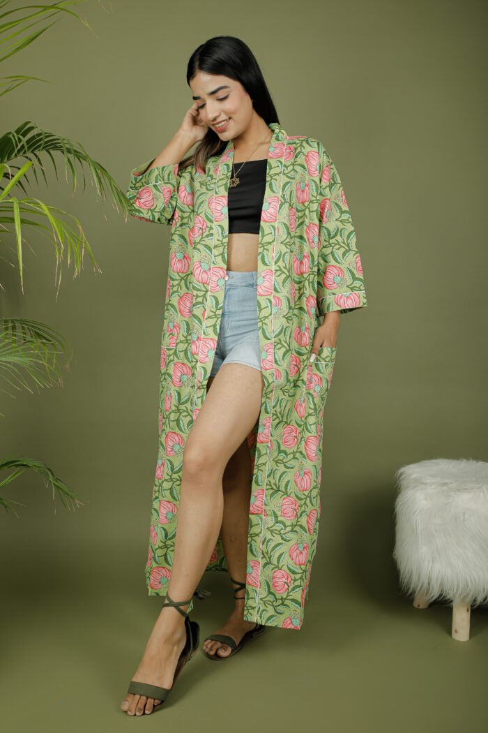 model wearing floral print green color kimono dress on olive green background