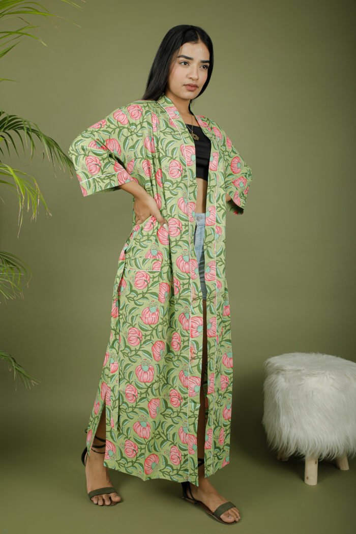 model wearing floral print green color kimono dress on olive green background