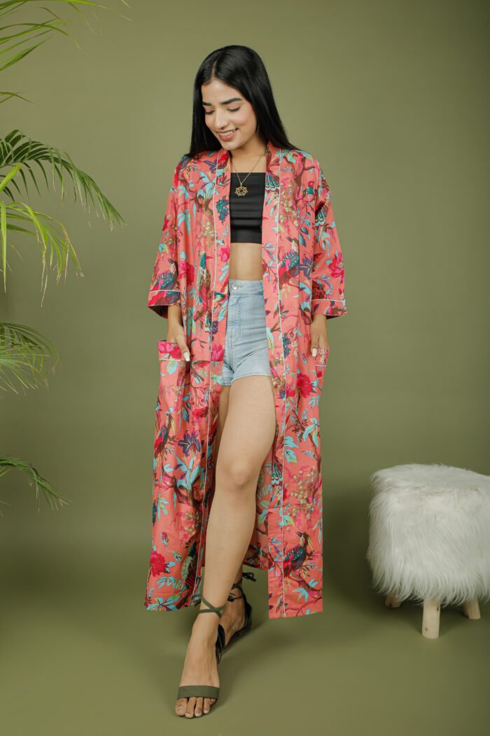 model wearing floral print pink color kimono sleeves dress on olive green background