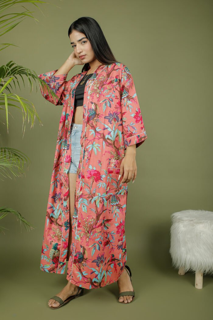 model wearing floral print pink color kimono sleeves dress on olive green background