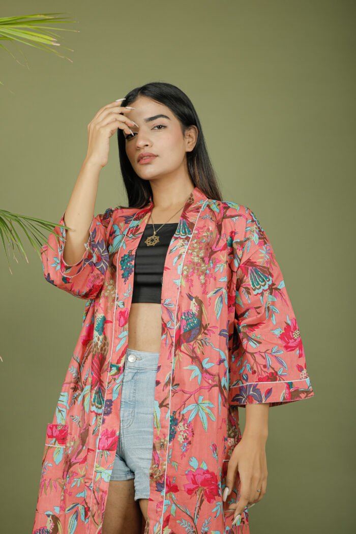 model wearing floral print pink color kimono sleeves dress on olive green background