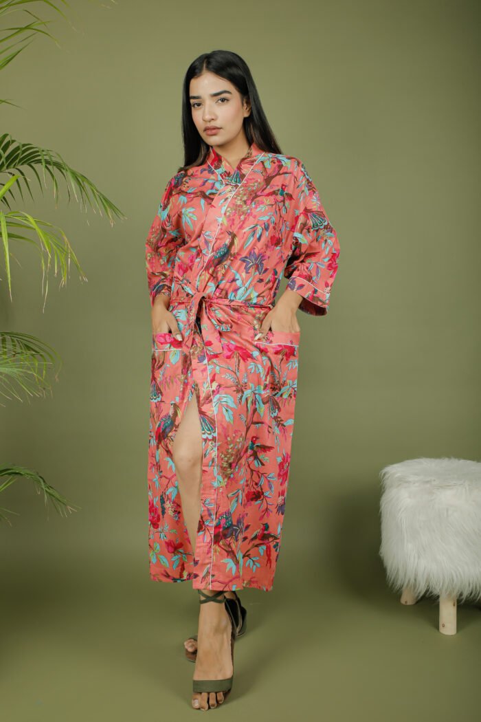 model wearing floral print pink color kimono sleeves dress on olive green background