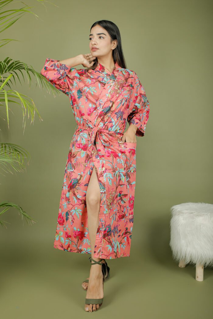 model wearing floral print pink color kimono sleeves dress on olive green background