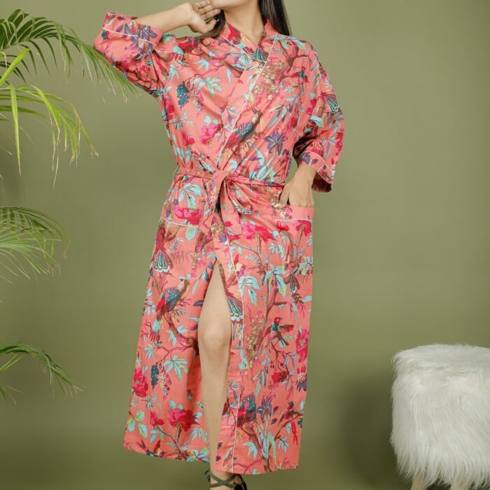 model wearing floral print pink color kimono sleeves dress on olive green background