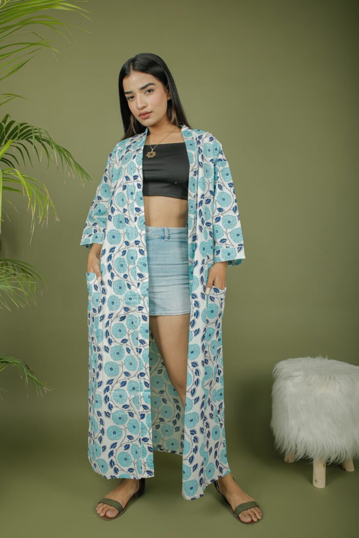 model wearing floral print sky blue color kimono shrug on olive green background