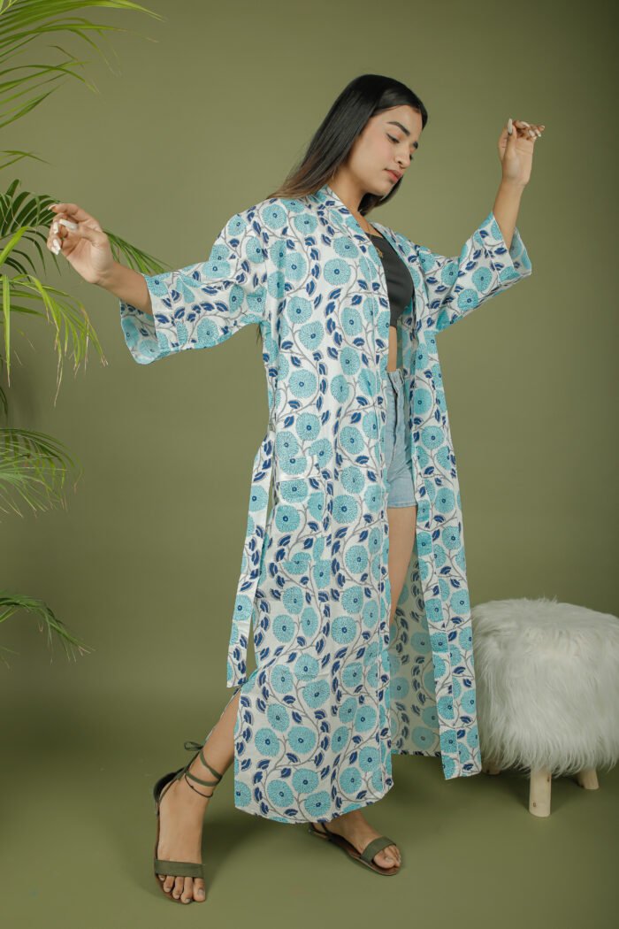 model wearing floral print sky blue color kimono shrug on olive green background