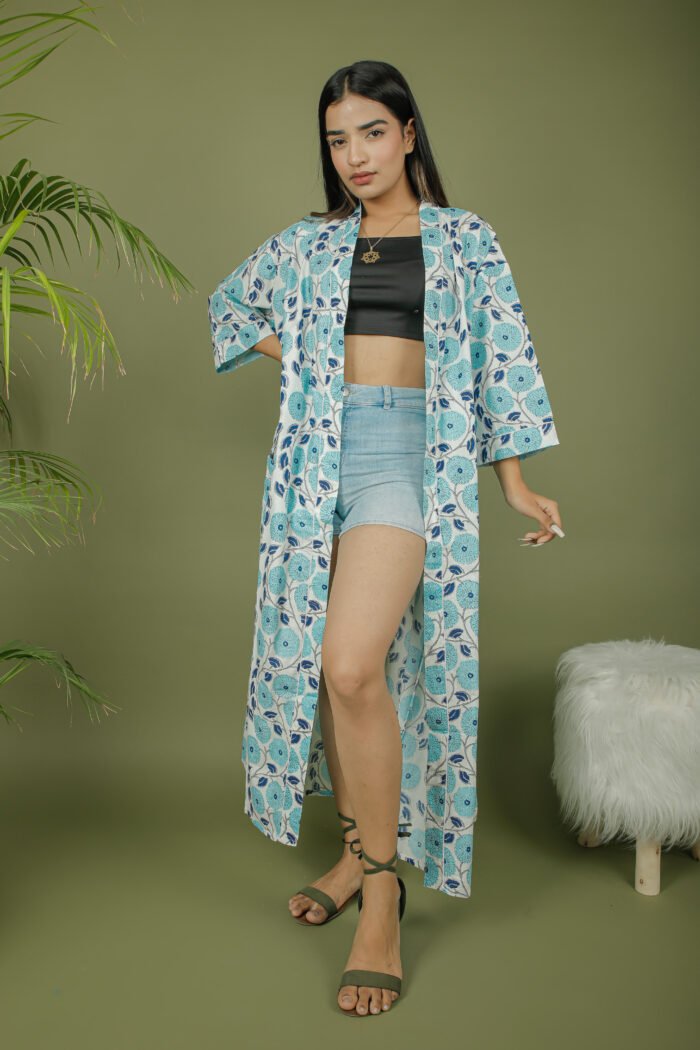 model wearing floral print sky blue color kimono shrug on olive green background