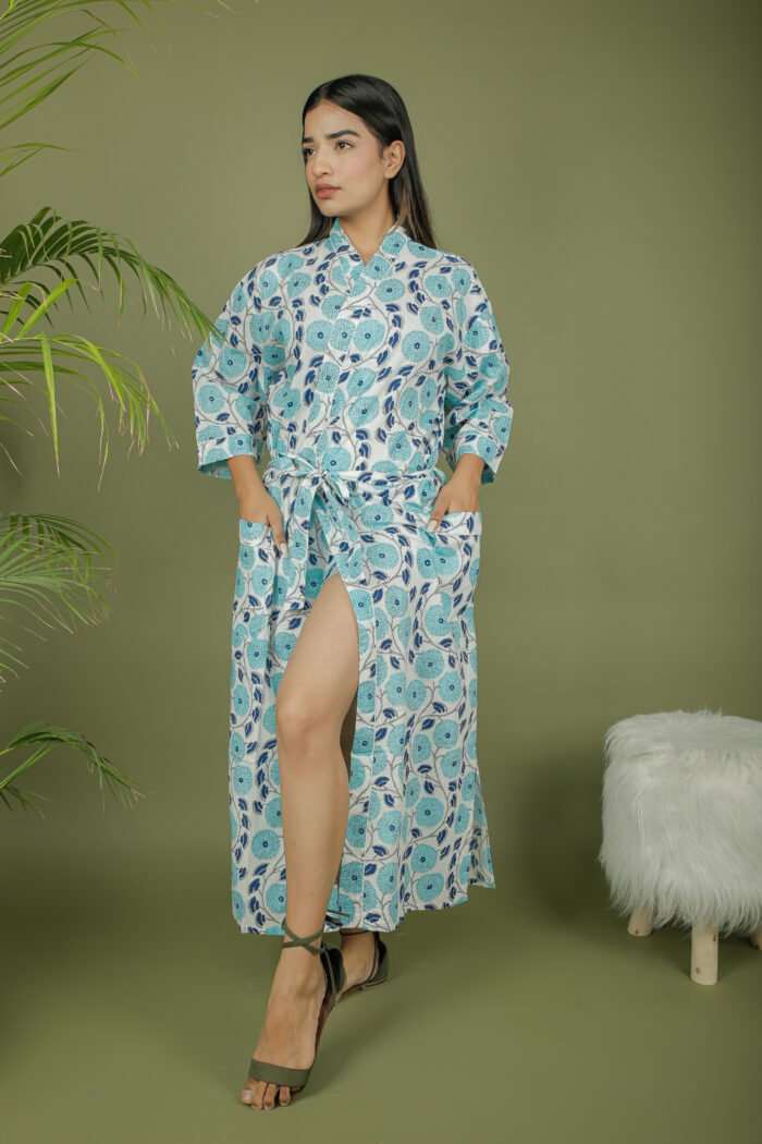 model wearing floral print sky blue color kimono shrug on olive green background