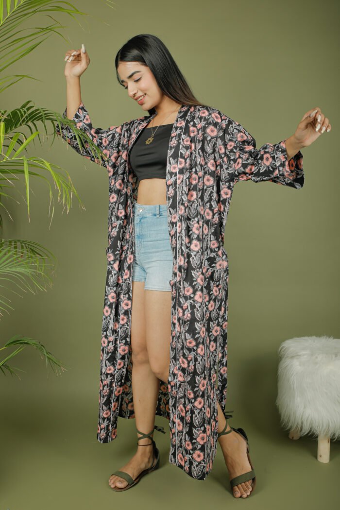 model wearing floral print black color kimono robe on olive green background