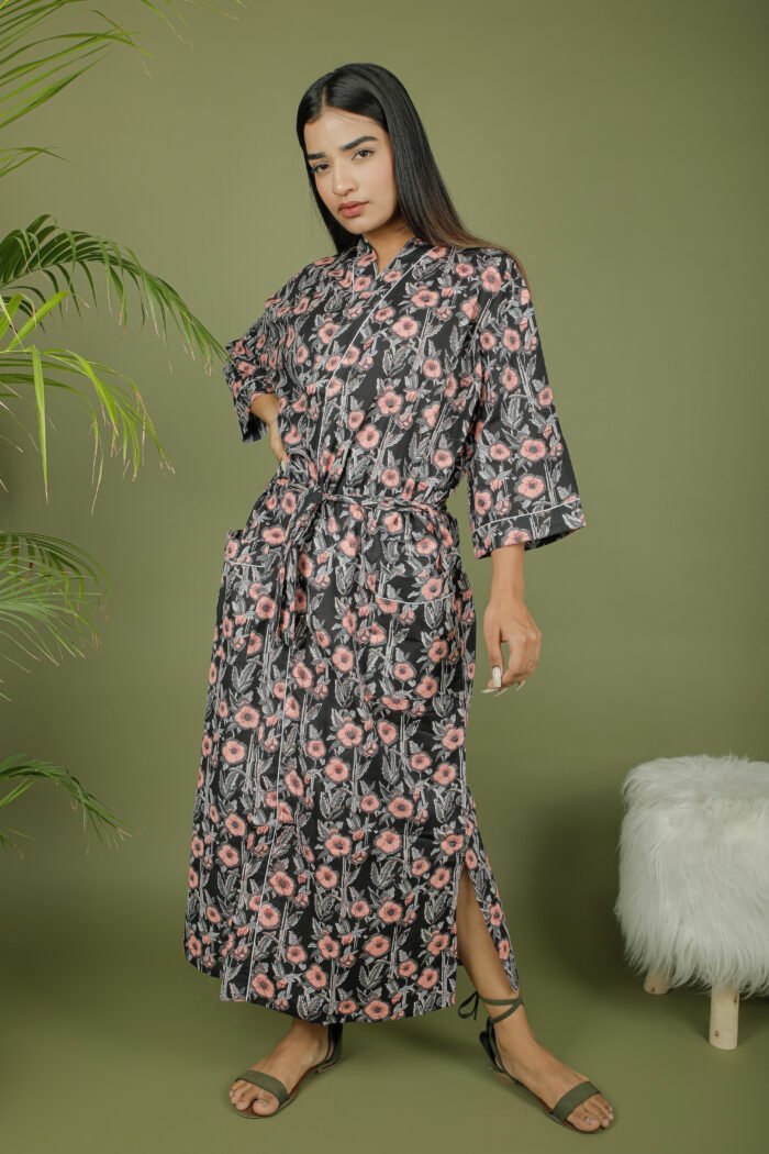 model wearing floral print black color kimono robe on olive green background