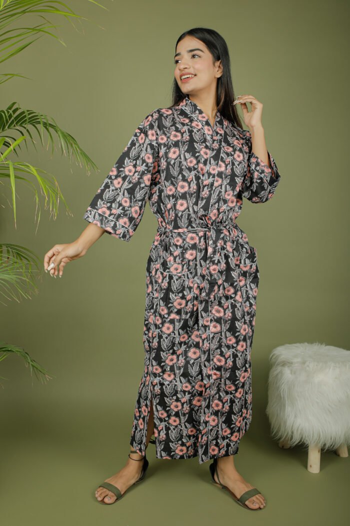 model wearing floral print black color kimono robe on olive green background