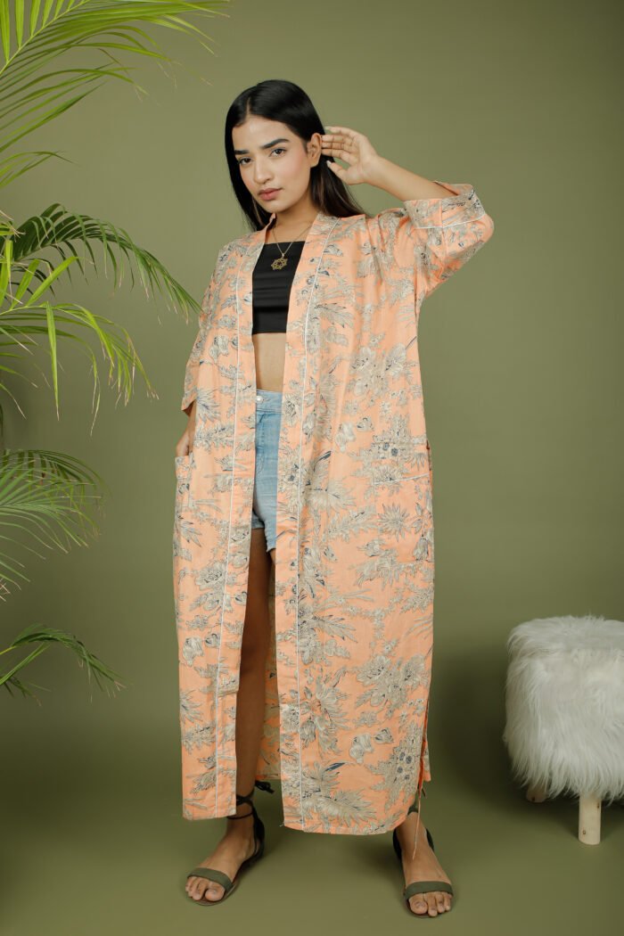 model wearing floral print beige color kimono on olive green background