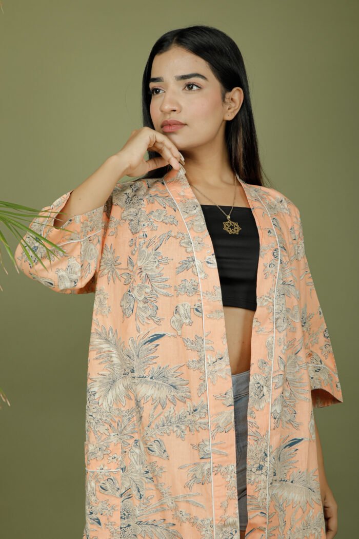 model wearing floral print beige color kimono on olive green background