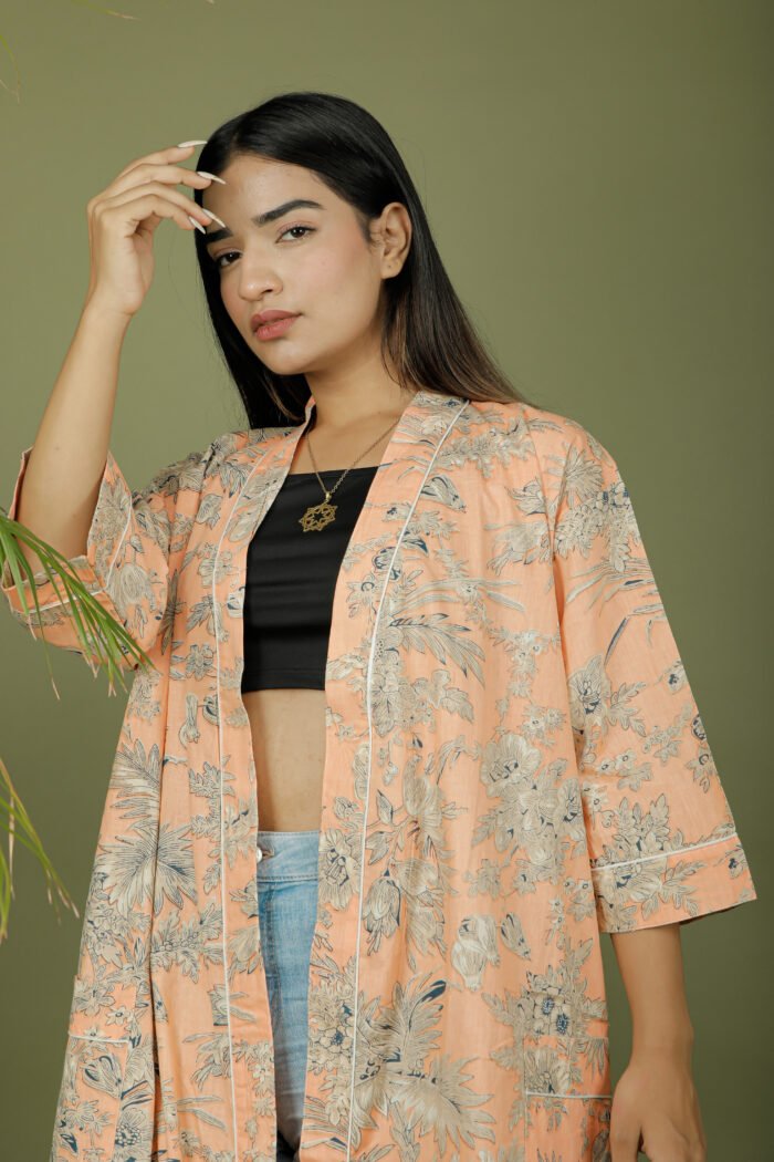 model wearing floral print beige color kimono on olive green background