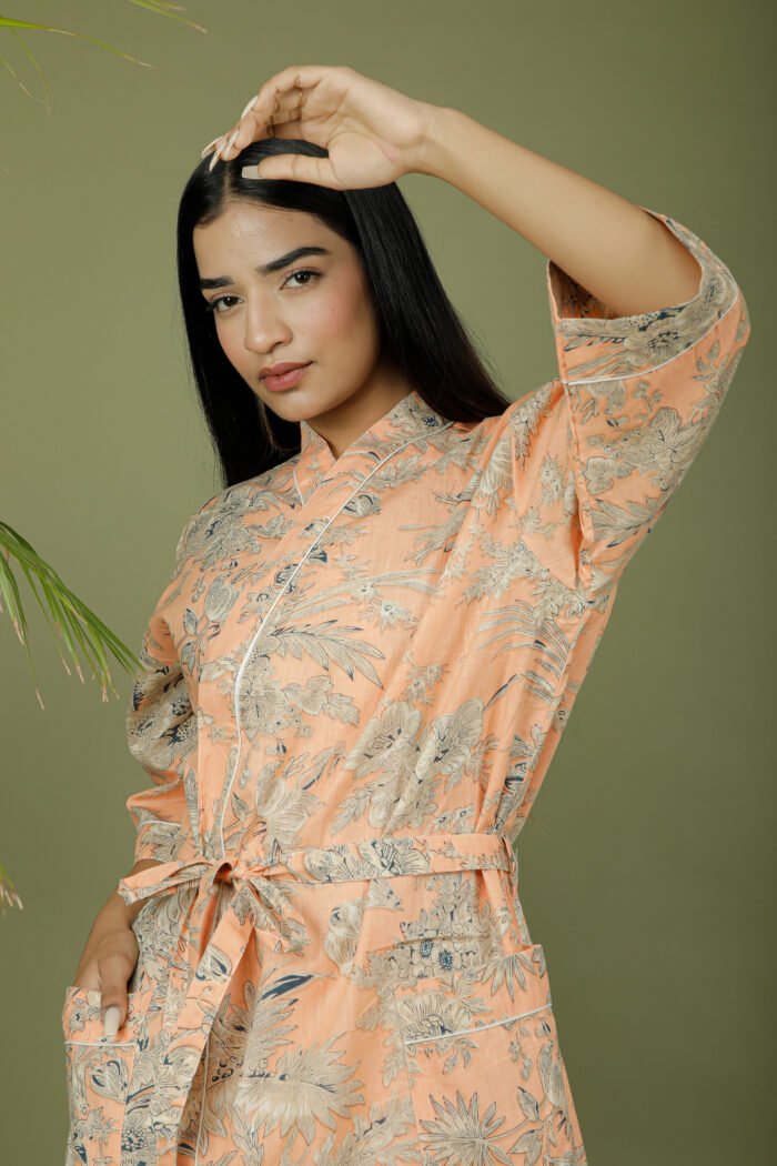 model wearing floral print beige color kimono on olive green background